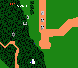 A screenshot from the NES edition of Xevious, that looks similar to the above arcade one in terms of general setup. However, the quality is obviously lessened in the move to Nintendo's 8-bit hardware.