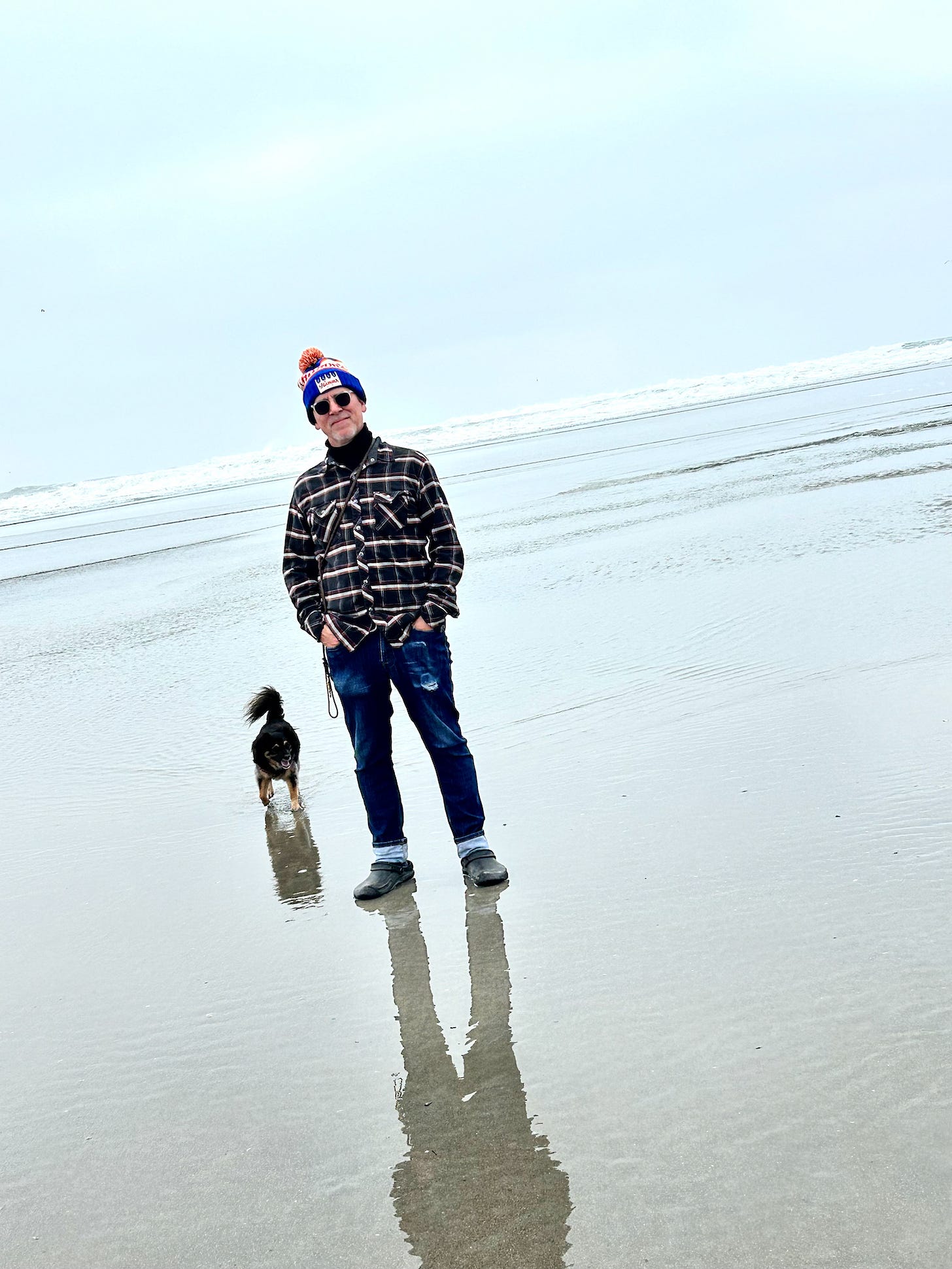 singing cowboy Faux Jean wearing "regularish" clothes at Ocean Beach with Teenie, faux walking on water. Happy.