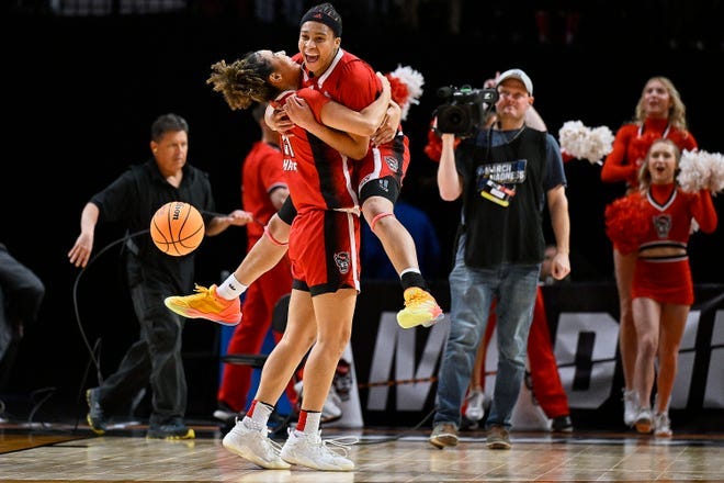 Madison Hayes (21) celebrates with Zoe Brooks (35) after NC State beat Stanford on Friday to advance to the Elite Eight.