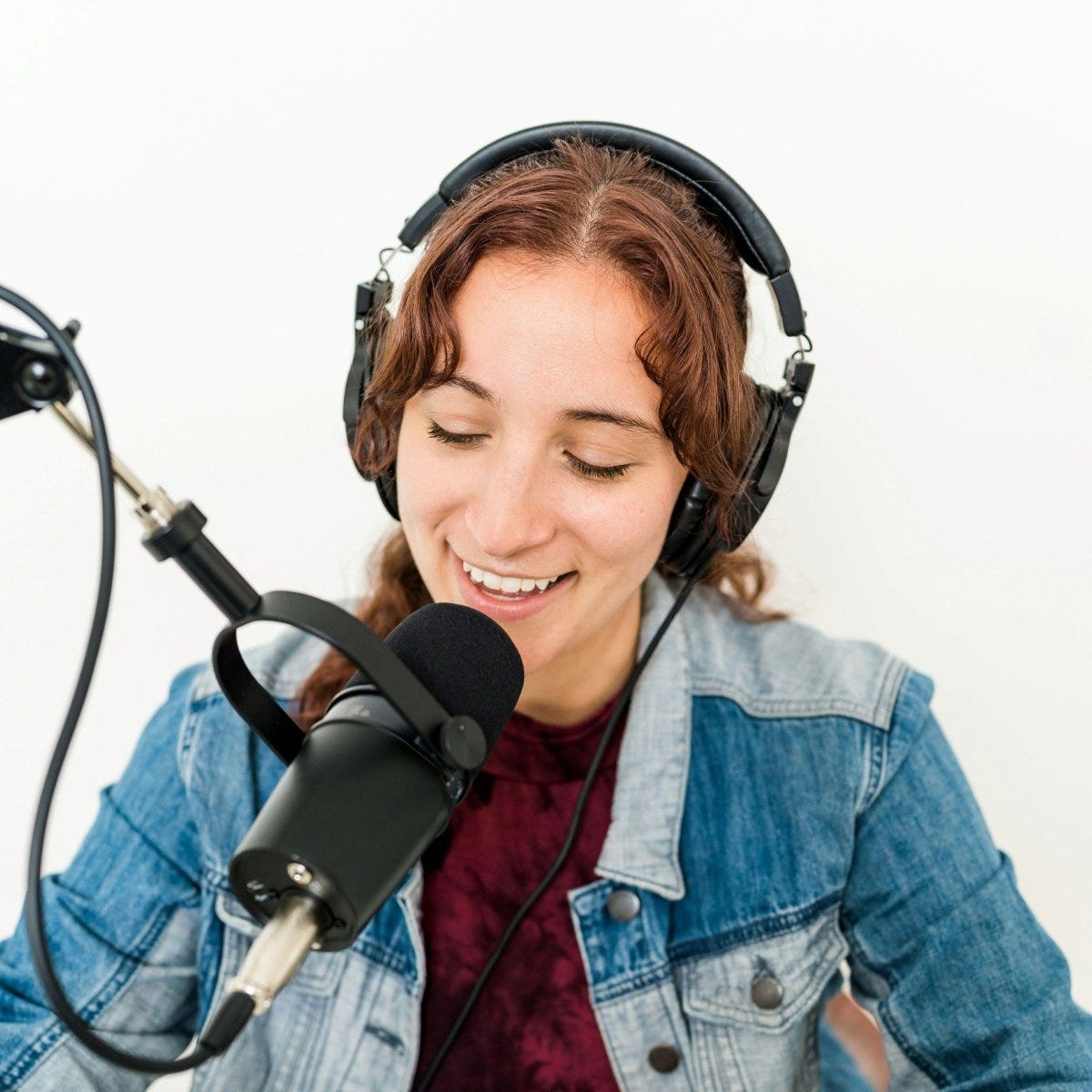 A podcaster talking to a mic A podcaster talking to a mic