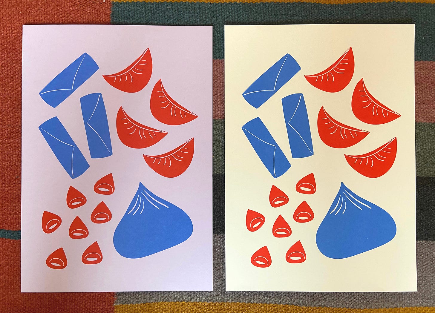 Two riso prints featuring blue and red dumplings, one on lilac paper and one on cream paper