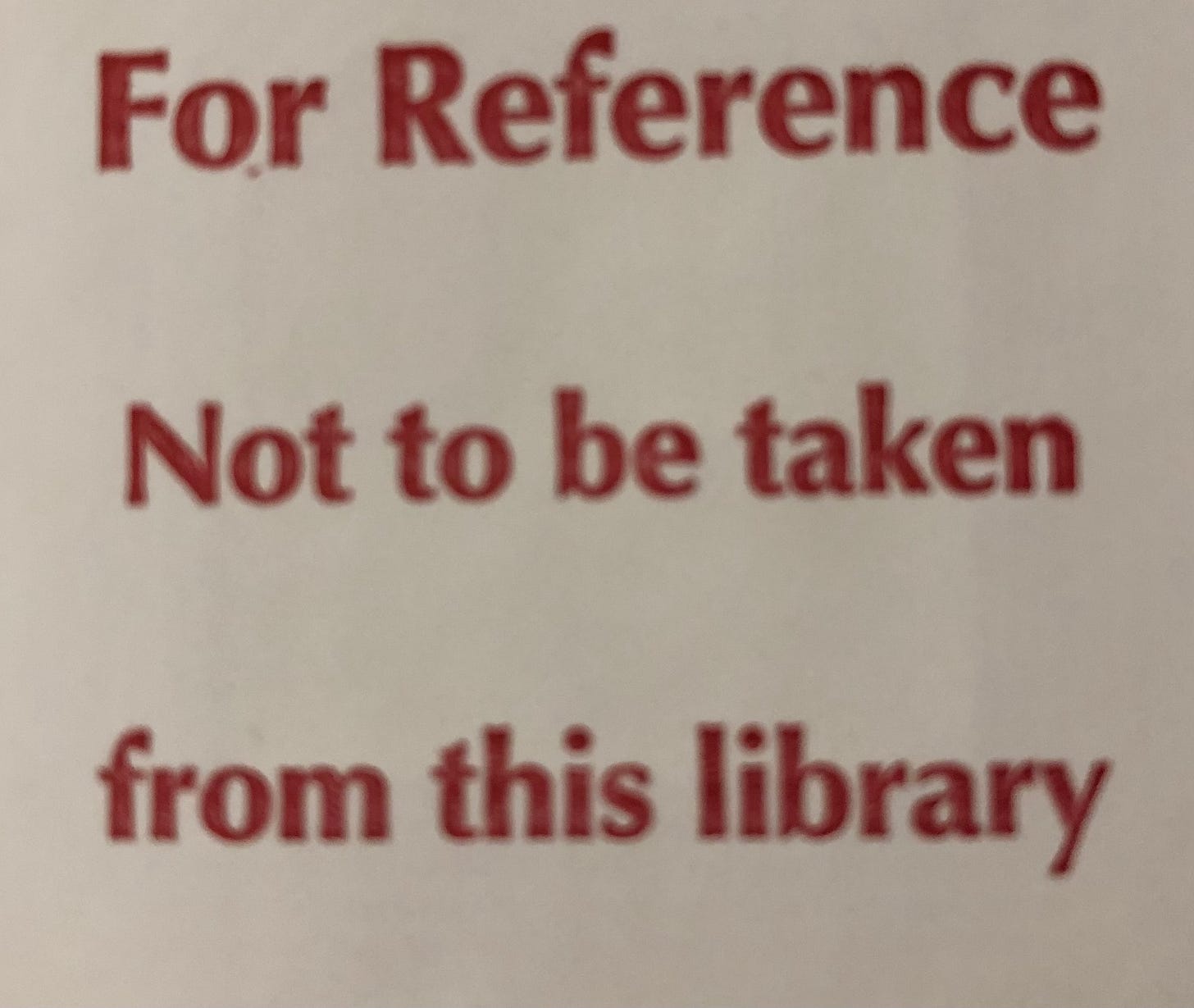 A sticker from the back of a library book that states: For reference . Not to be taken from this library.