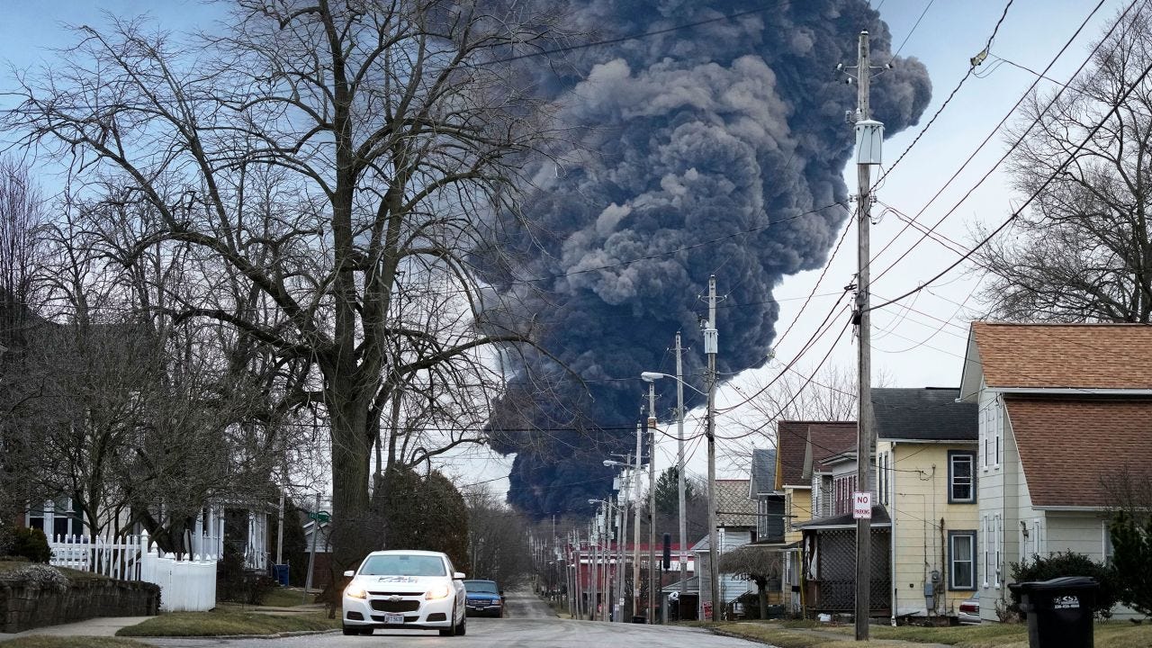 A black plume rises after the controlled detonation Monday in East Palestine, Ohio