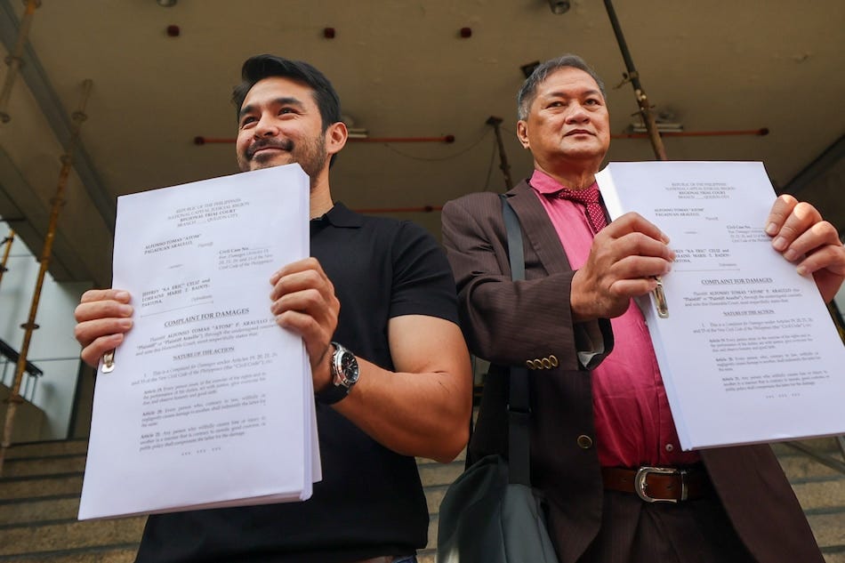 Broadcast personality Atom Araullo (left) poses with his lawyer, Atty. Tony La Viña, before filing a P2-million complaint for civil damages at the Quezon City Regional Trial Court on September 11, 2023 against Jeffrey Celis and Lorraine Badoy, allegedly for red-tagging him. Jire Carreon, ABS-CBN News