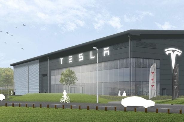 CGI image showing the proposed Tesla dealership. A large grey building with the word Tesla across the top.