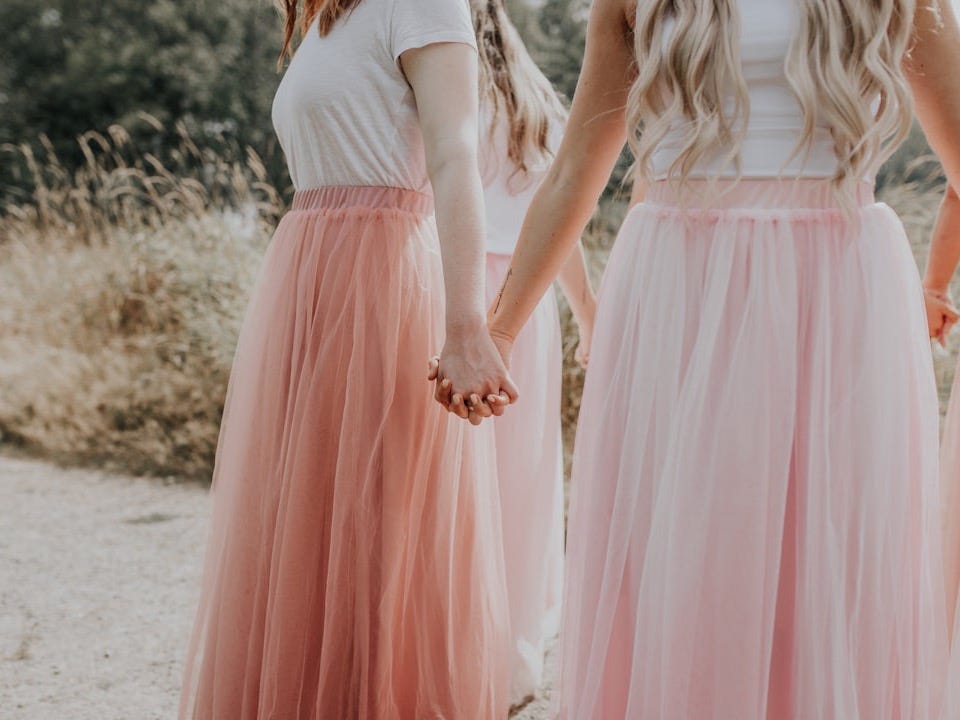 woman in white and pink dress