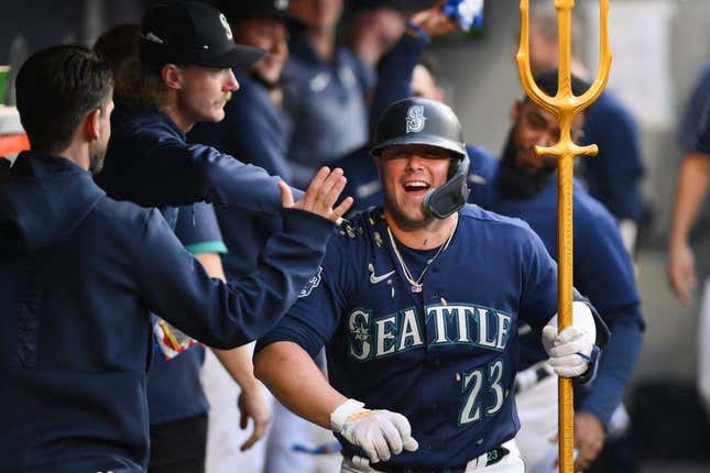 May 25, 2023; Seattle, Washington, USA; Seattle Mariners first baseman Ty France (23) celebrates in the dugout after hitting a home run against the Oakland Athletics during the sixth inning at T-Mobile Park.