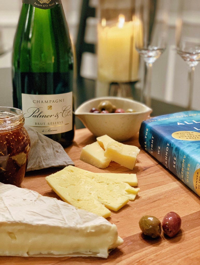 Photograph of French and German wine and cheese to immerse in the text of All The Light We Cannot See.