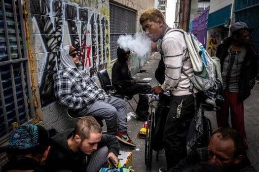Elliot, 24, bottom left, who says he began using heroin at age 12 and is addicted to fentanyl, hangs out in an alley by MacArthur Park near downtown Los Angeles where drug use is rampant. (Photo by Sarah Reingewirtz, Los Angeles Daily News/SCNG)

