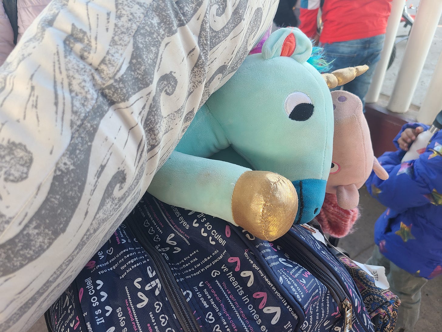 a stuffed animal on top of a suitcase