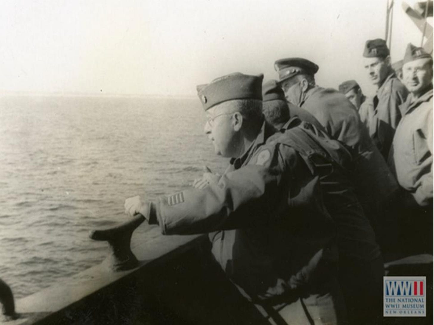 Soldiers on troop ship looking at the ocean, heading home after WWII Soldiers on troop ship looking at the ocean, heading home after WWII