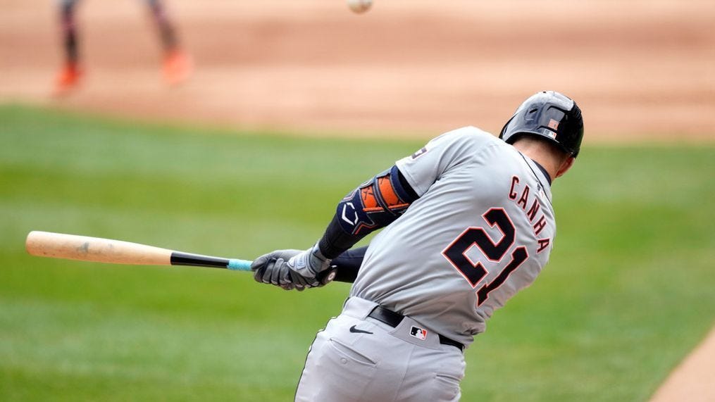 Detroit Tigers' Mark Canha hits a two-run single off Chicago White Sox starting pitcher Michael Soroka during the first inning of a baseball game Saturday, March 30, 2024, in Chicago. Spencer Torkelson and Riley Greene scored on the play. (AP Photo/Charles Rex Arbogast)