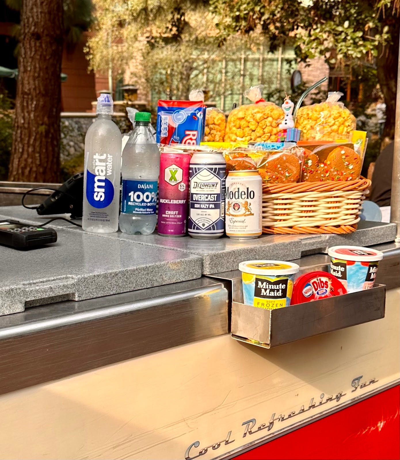 A drink and snack cart from California Adventure that features a couple beer cans
