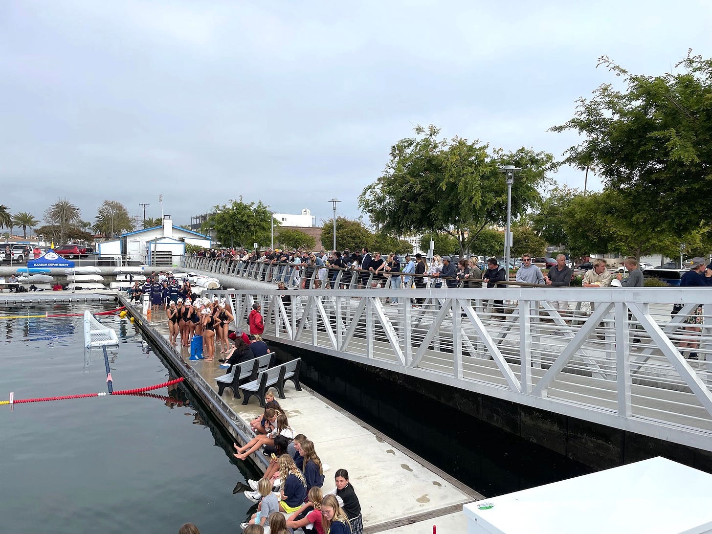 Water polo IN THE Bay crowd lining railing SNN 5.19