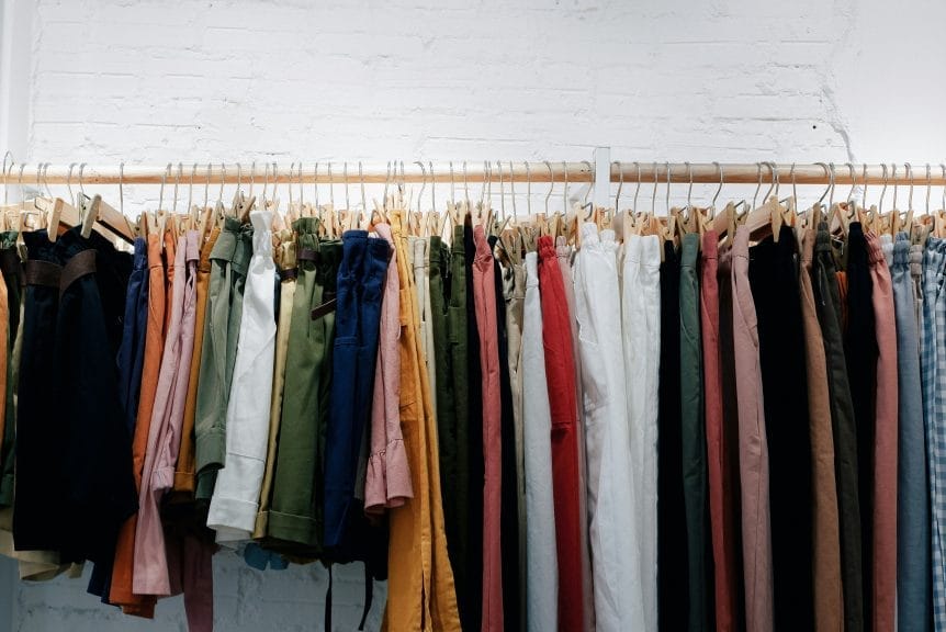 Various different clothing items hanging from a rail. Aesthetics. 