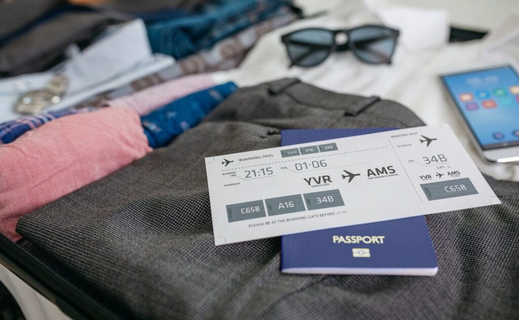 Boarding pass and passport in businessman's suitcase