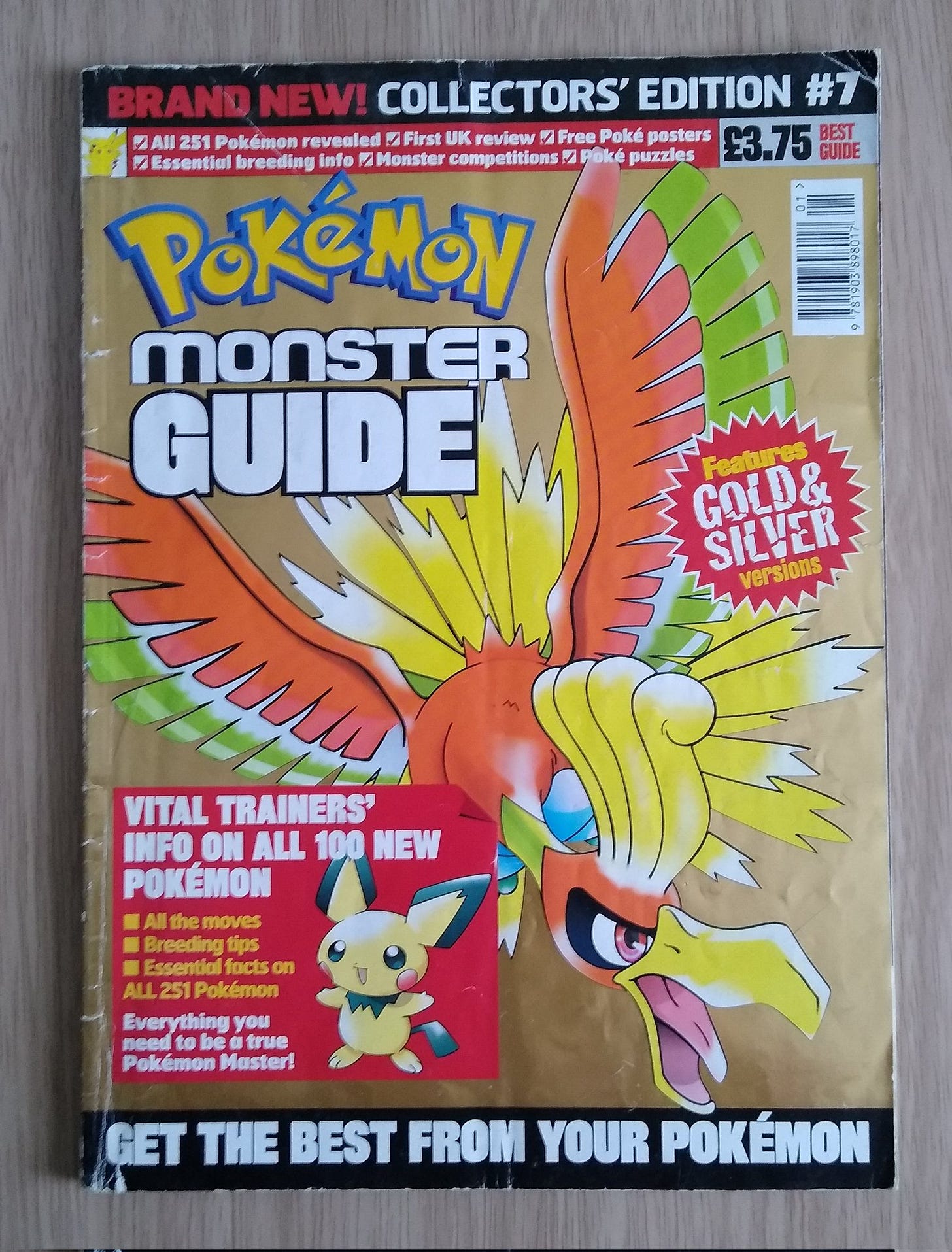 An issue of Pokémon Monsters Guide, with Ho-Oh on the cover, containing vital trainer's info on all 100 new Pokémon at the time