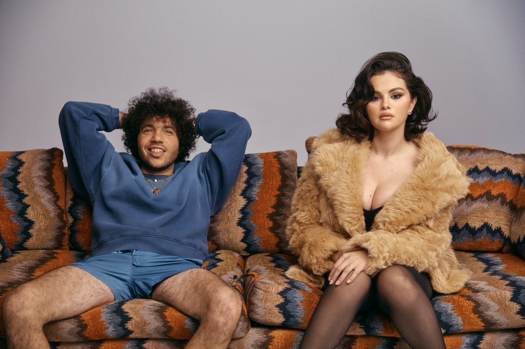Selena Gomez and Benny Blanco on a couch