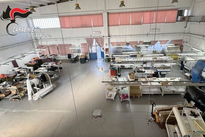 A workshop where Armani products were made in northern Italy is seen in a partially redacted photo provided by Italy’s Carabinieri police. A workshop where Armani products were made in northern Italy is seen in a partially redacted photo provided by Italy’s Carabinieri police.