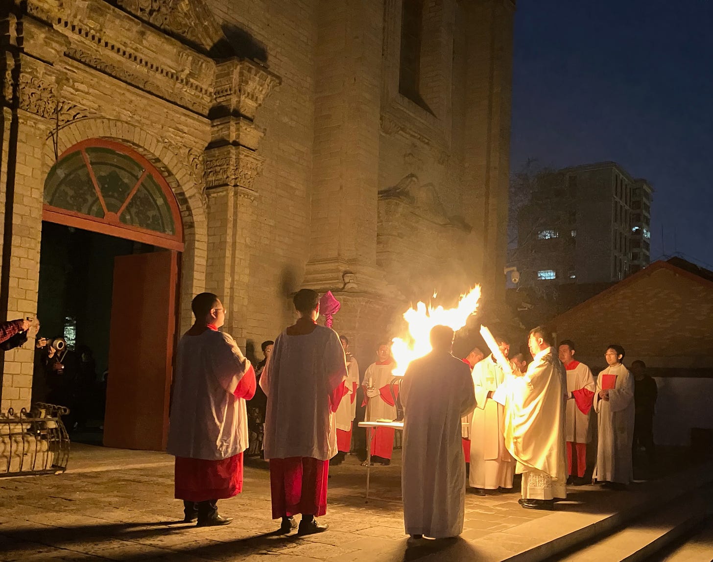 The pascal candle is lit outside the Cathedral of the Immaculate Conception, which was closed during the Cultural Revolution, from 1966 to 1979.