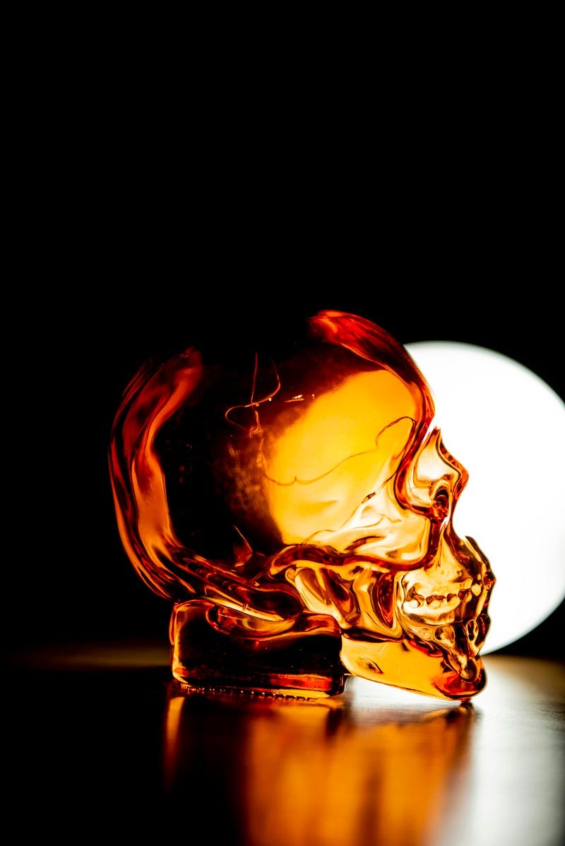 A gold glass skull.