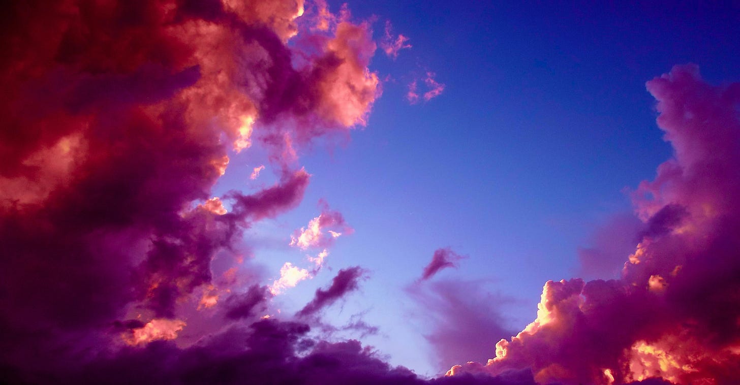 A blue sky with purple clouds. 