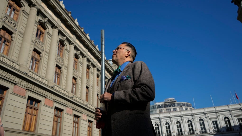 Born in Chile and adopted in the U.S., Marine Jimmy Lippert Thyden arrives at the Supreme Court to present a criminal complaint against the Chilean government for child abduction, a widespread practice that spanned decades, in Santiago, Chile, Monday, July 1, 2024. (AP Photo/Esteban Felix)