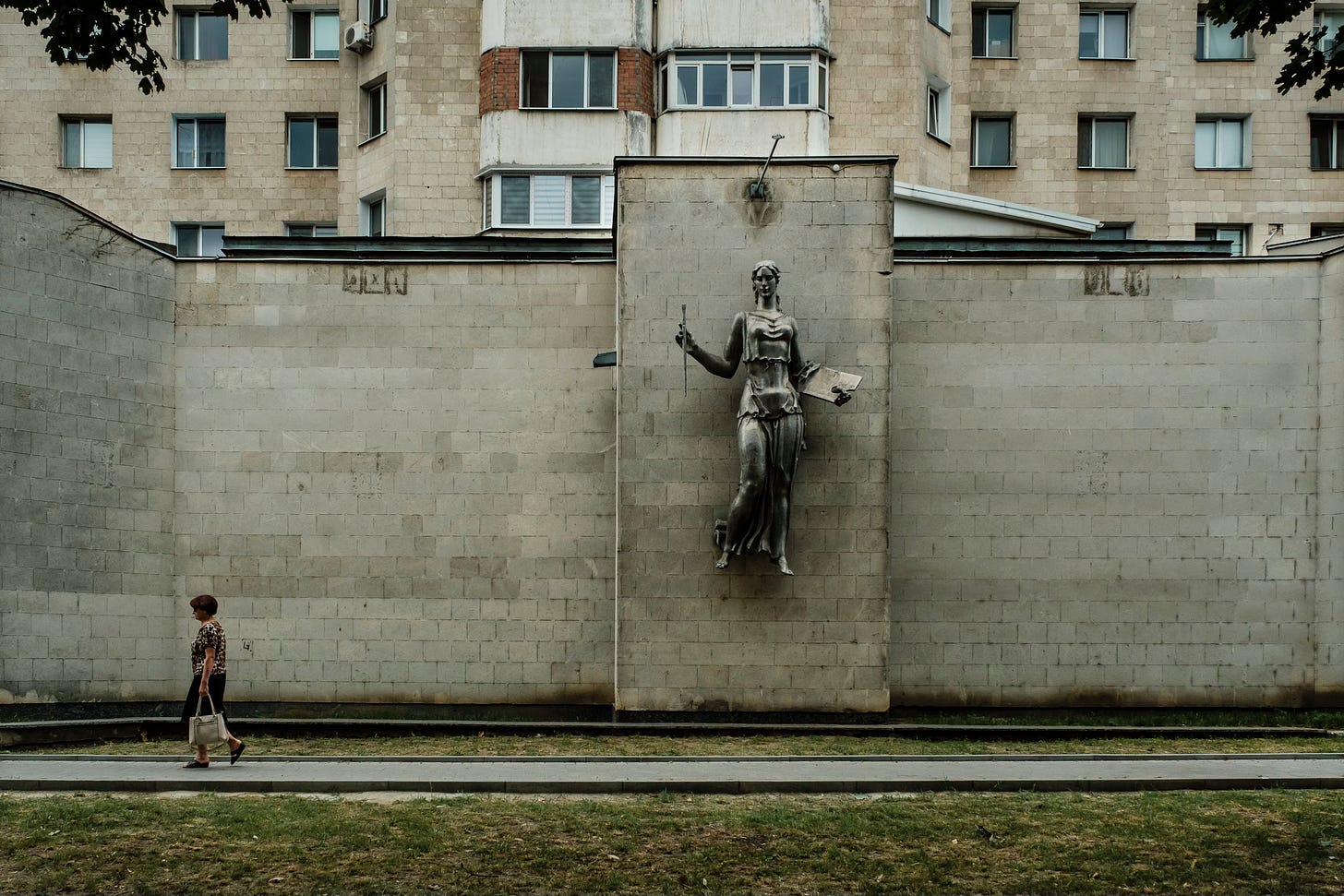 Chisinau, Moldova: a woman passes by the culturel centre Brancusi