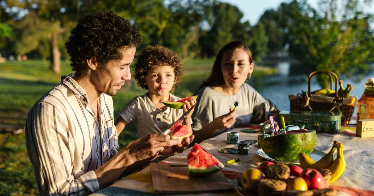 A family eating watermelon together