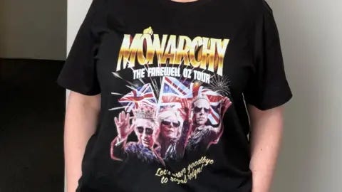 Australian Republican Movement A woman wearing the Australian Republican Movement merch. It's a t-shirt which reads "Monarchy the farewell Oz tour" and "Let's wave goodbye to Royal reign!". It features edited photos of King Charles in a crown, Queen Camilla and Prince William. All three are wearing sunglasses.