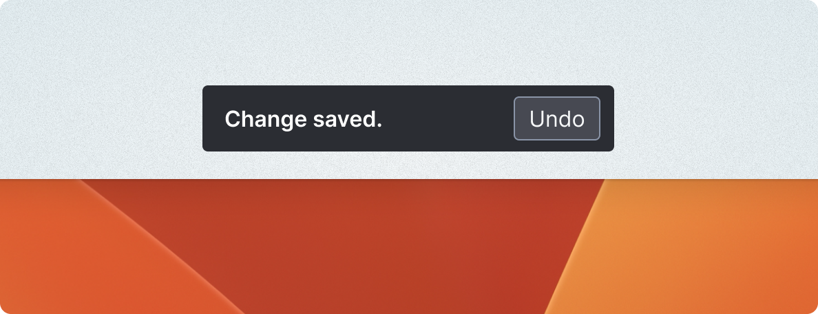 "Change saved" with an undo button.  Appearing center bottom of a window, in a contrasting color to draw attention.