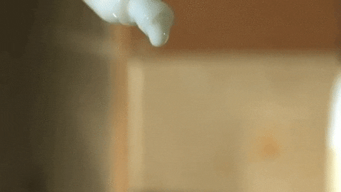 Animated gif of a thick liquid slowly dripping from a container