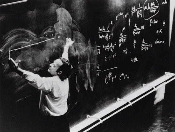 A person writing on a chalkboard

AI-generated content may be incorrect.