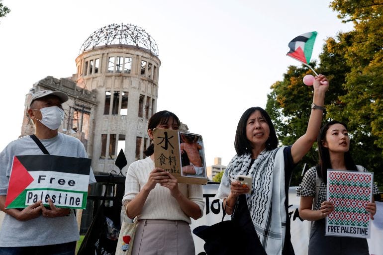 Demonstrators gather during a protest in support of Palestinians in Gaza, at the preserved Atomic Bomb Dome in the Hiroshima Peace Memorial Park, in Hiroshima, Japan, October 12, 2024. REUTERS/Kim Kyung-Hoon