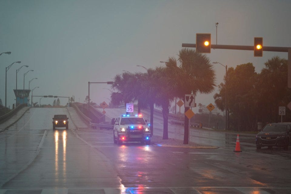 Police block off a bridge leading to the barrier island of St. Pete Beach, Florida