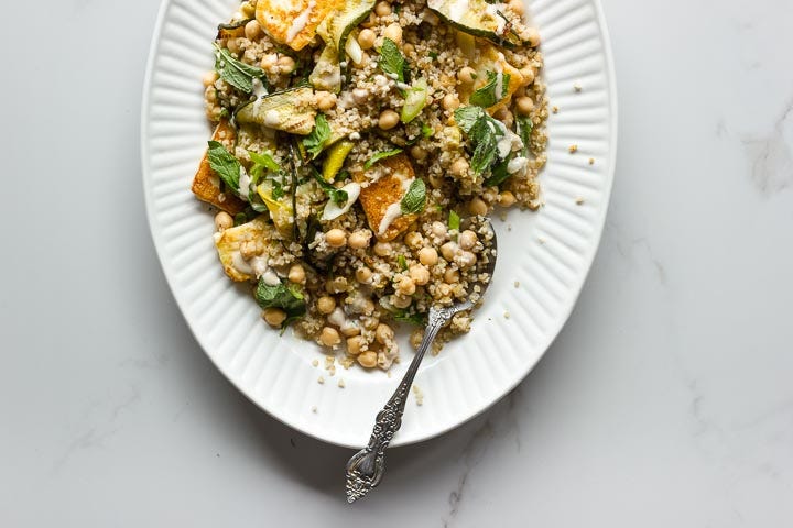 Grilled zucchini salad with halloumi, bulgur and chickpeas. Top with lots of fresh mint and a sweet and spicy tahini dressing. The ultimate summer salad.