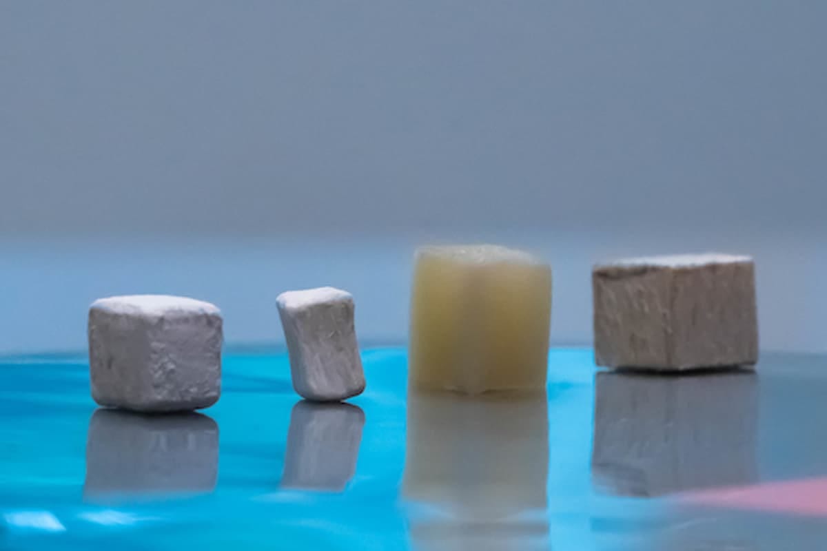 Wood at different stages of modification from natural (far right) to delignified (second from right), through to MOF-infused engineered wood (left of image)