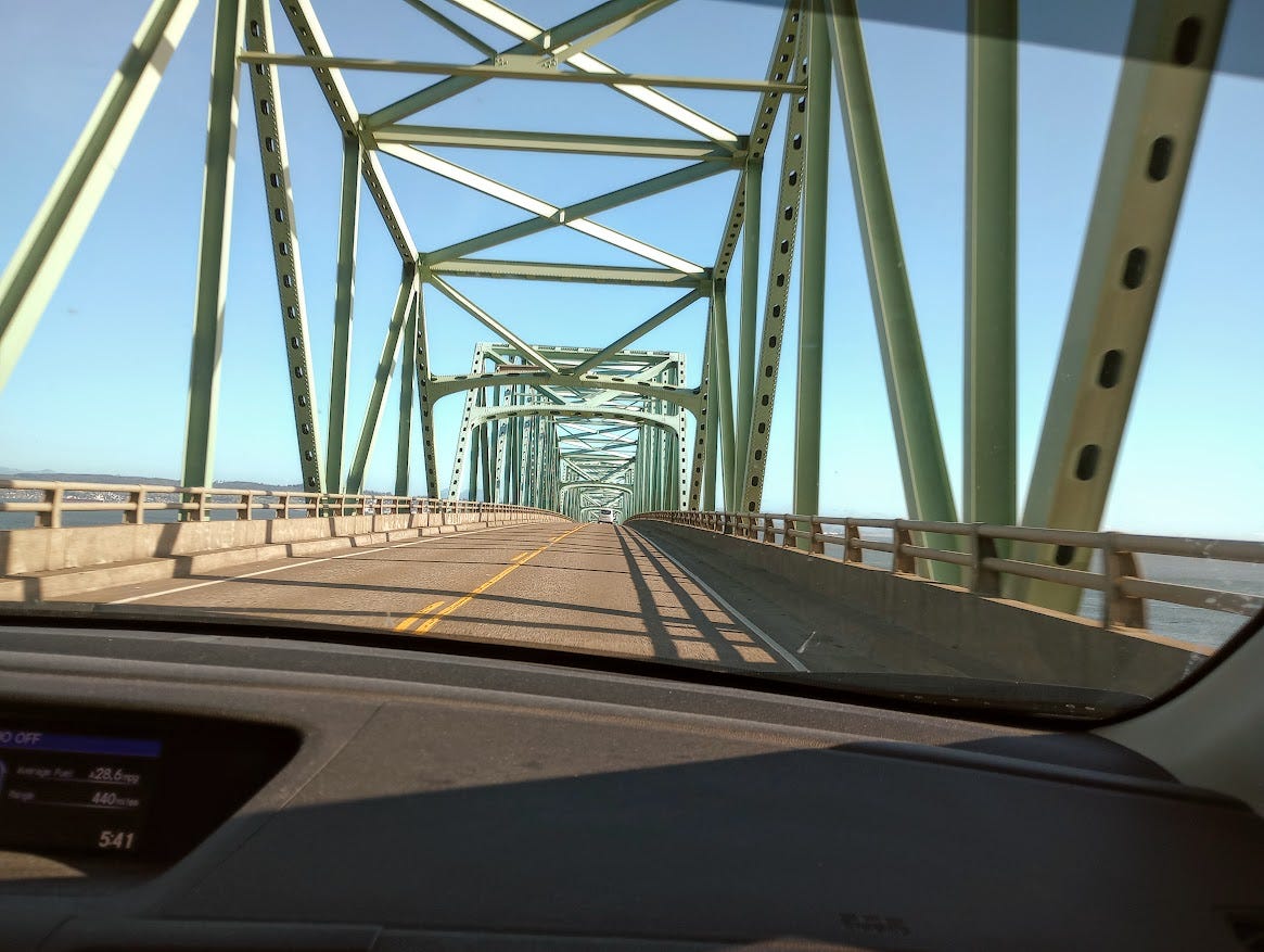 View from car of driving across bridge