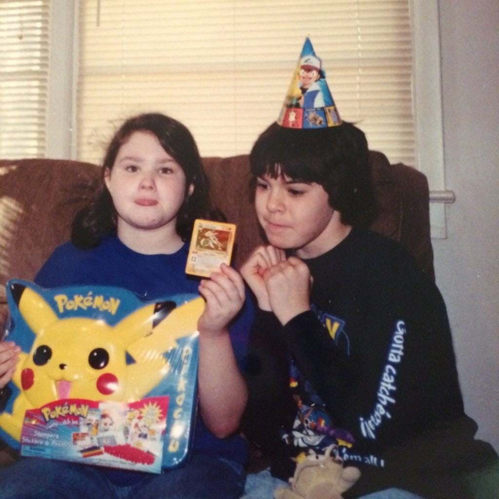 Carrie posing with her freshly pulled Kabutops card from the Pokémon TCG Fossil expansion