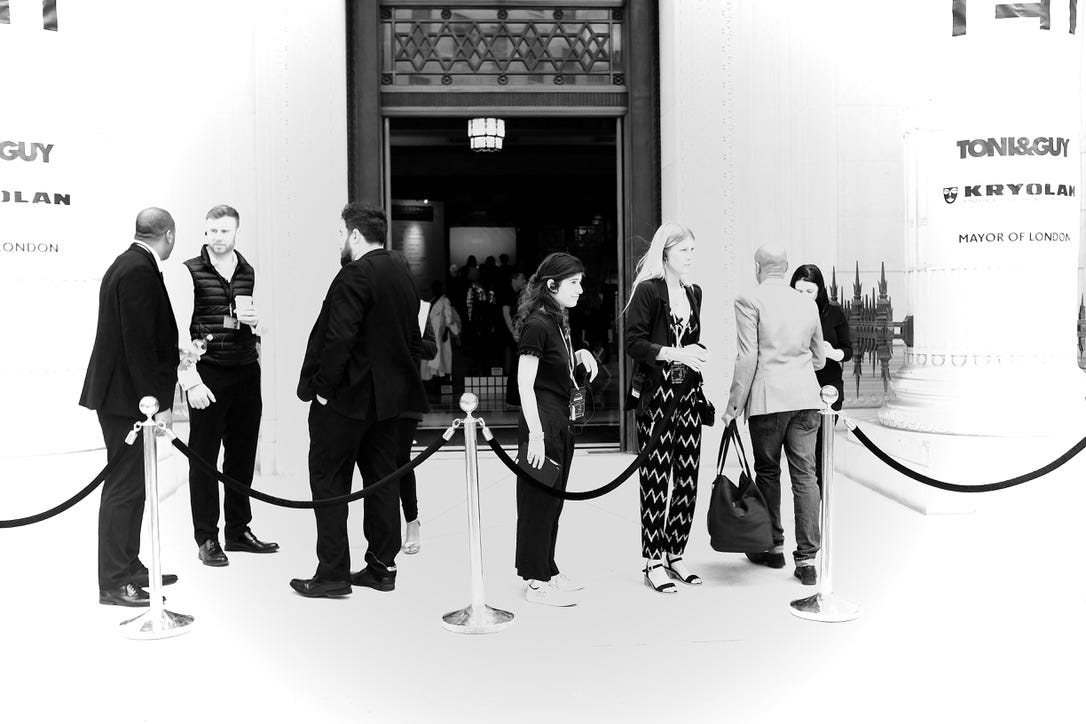 A group of people standing in line

Description automatically generated