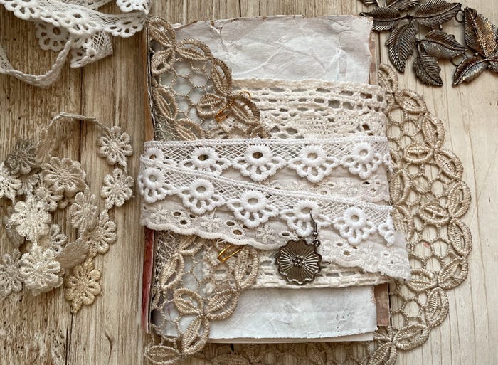 The Unbound Journal workshop. Image of a journal bound with fabric and lace