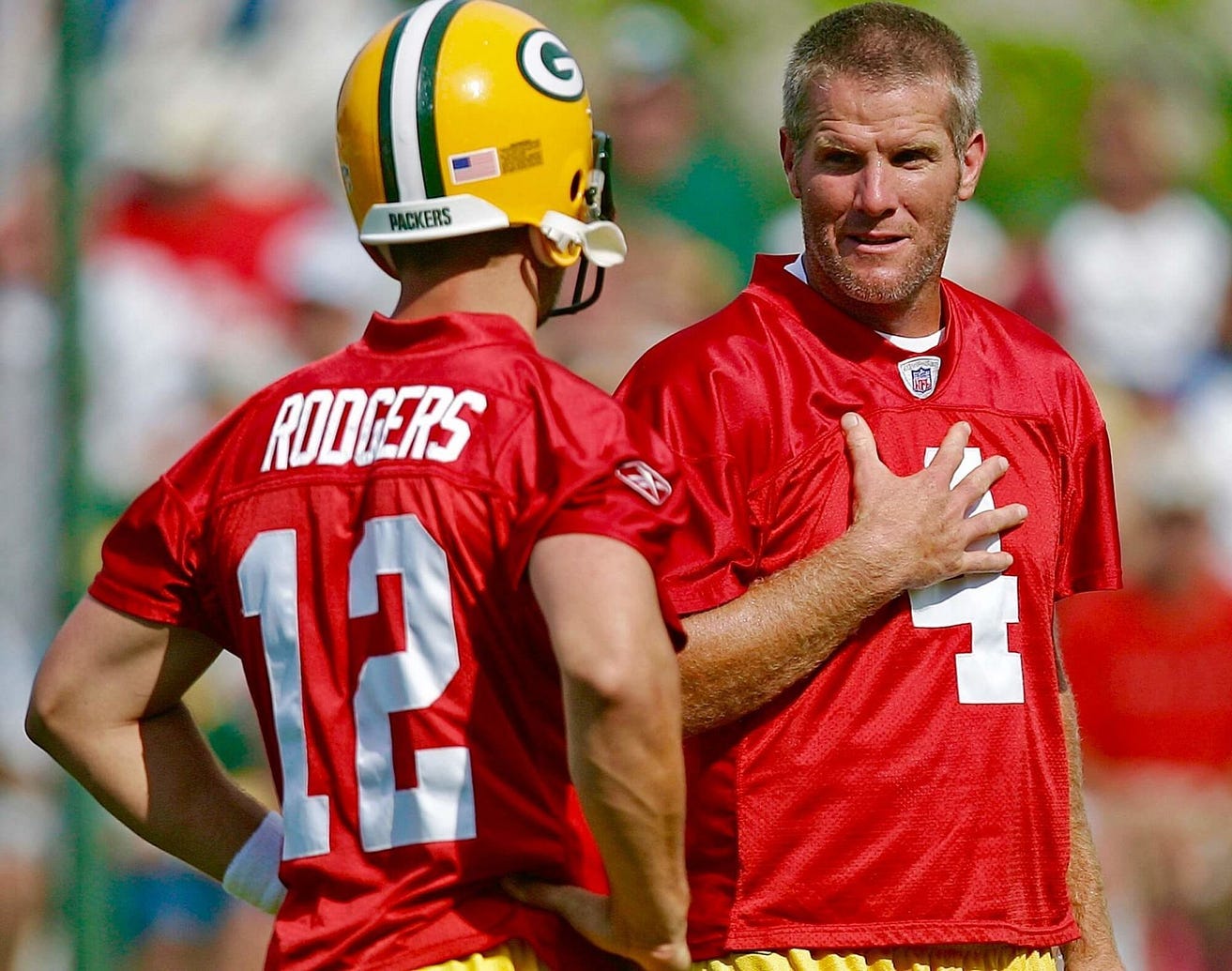 Aaron Rodgers being schooled by Brett Frave at Packers practice.