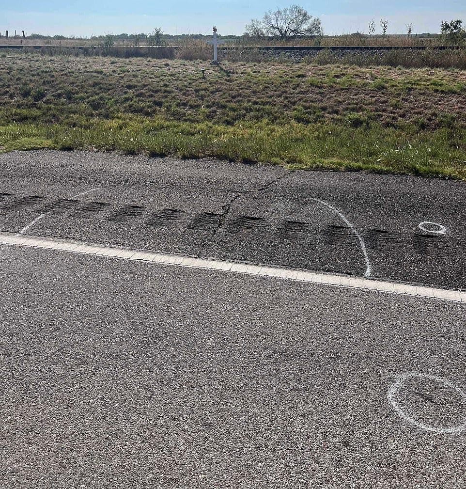 Presgrove's body was found between the two chalk lines, and teeth within the circles. In the background is a memorial set up for the teenager