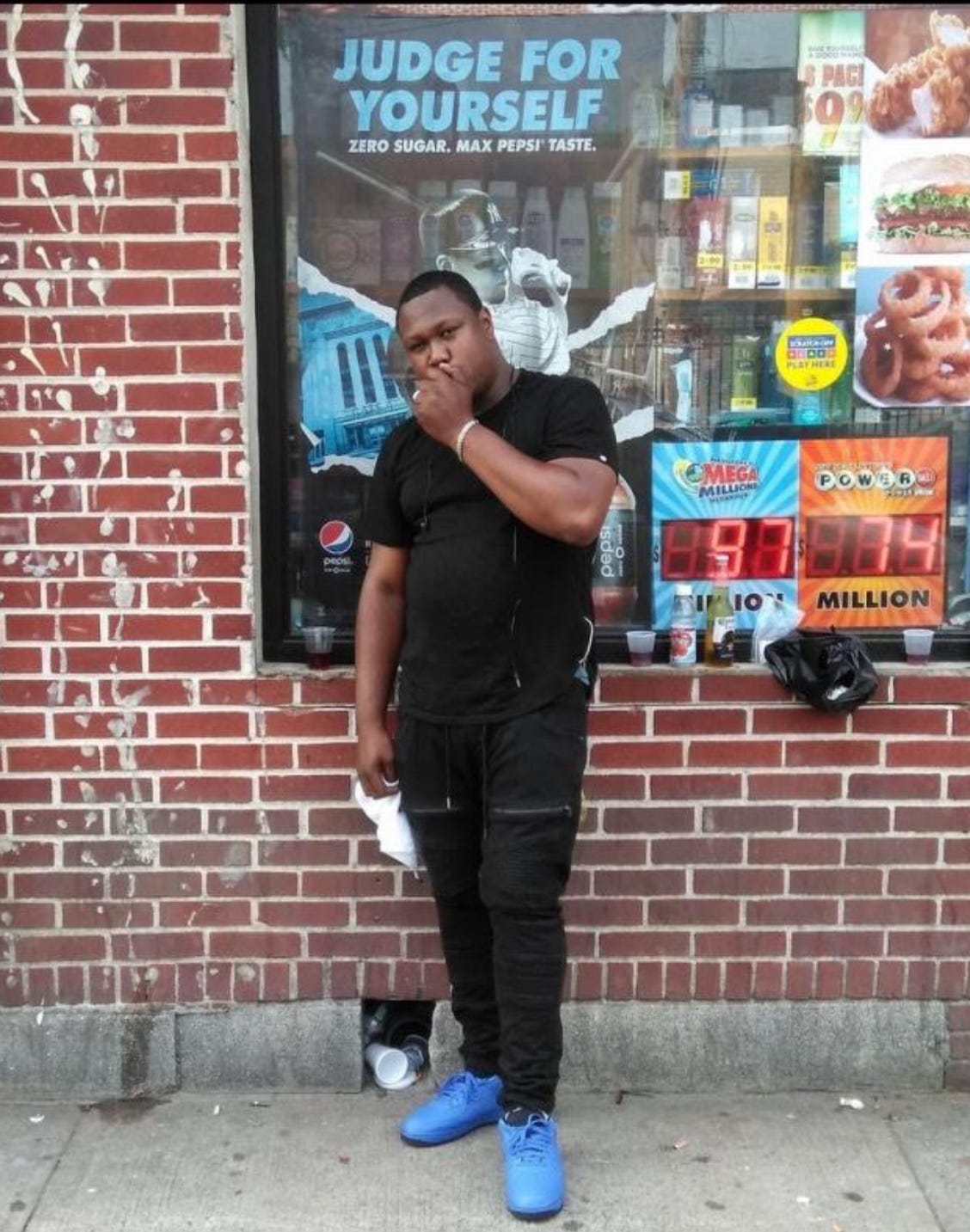 Jerrell Garris poses in front of a bodega in front of 51 Horton Avenue, near Brook Street.