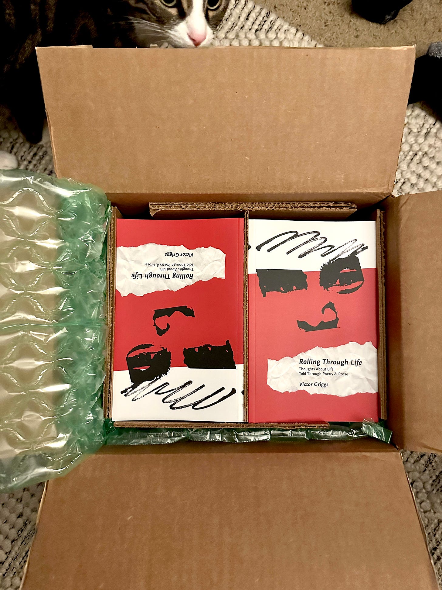 An open box with copies of the book, Rolling Through Life, on the day we received shipment of the printed copies.