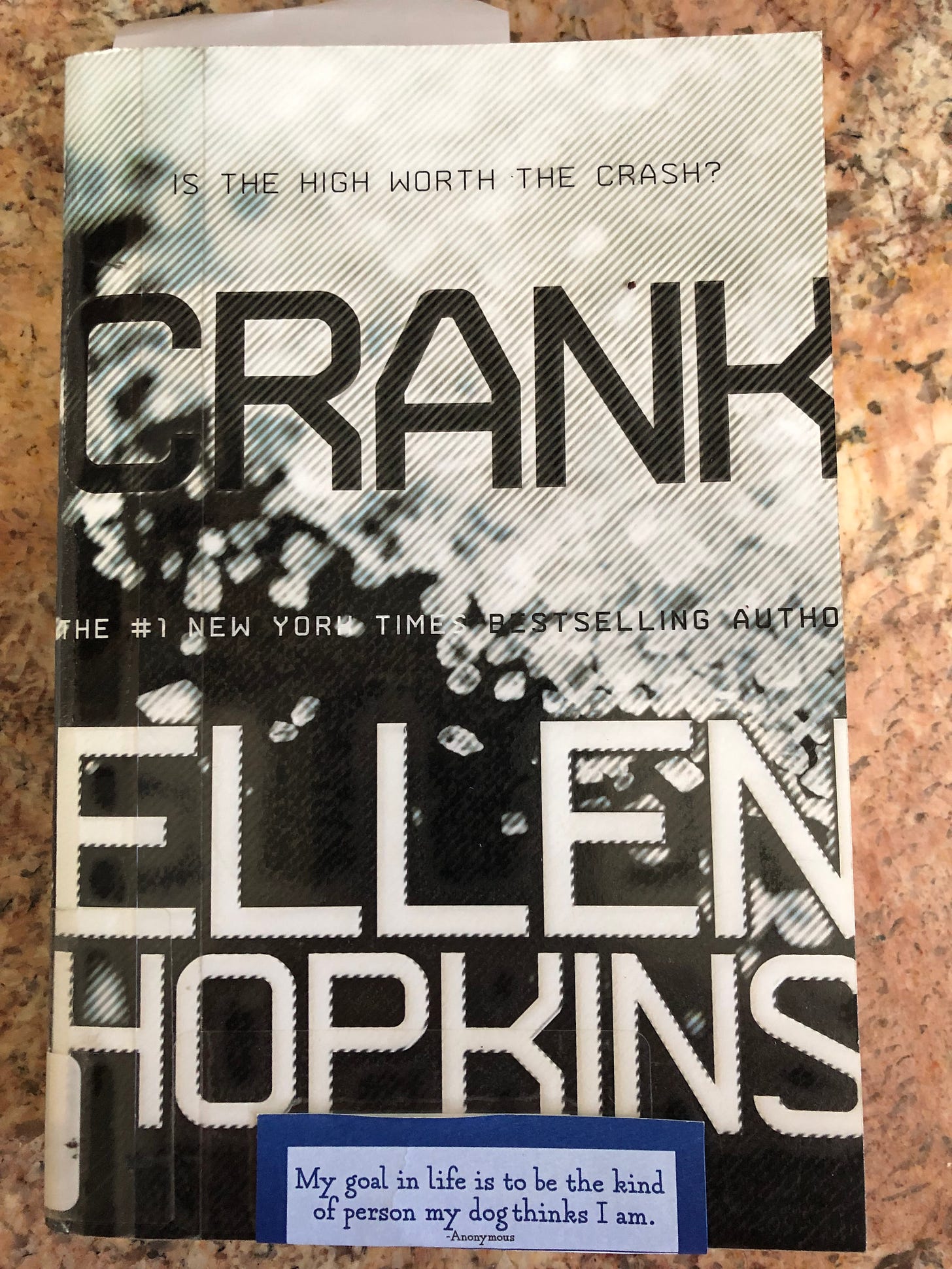 The book cover of Crank with the title and diagonally spilt between black and white. White section has teh vague appearance of crystals.