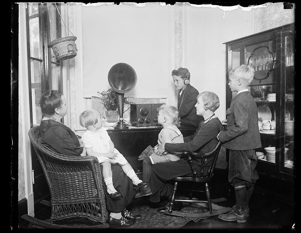 [Family group listening to radio?]