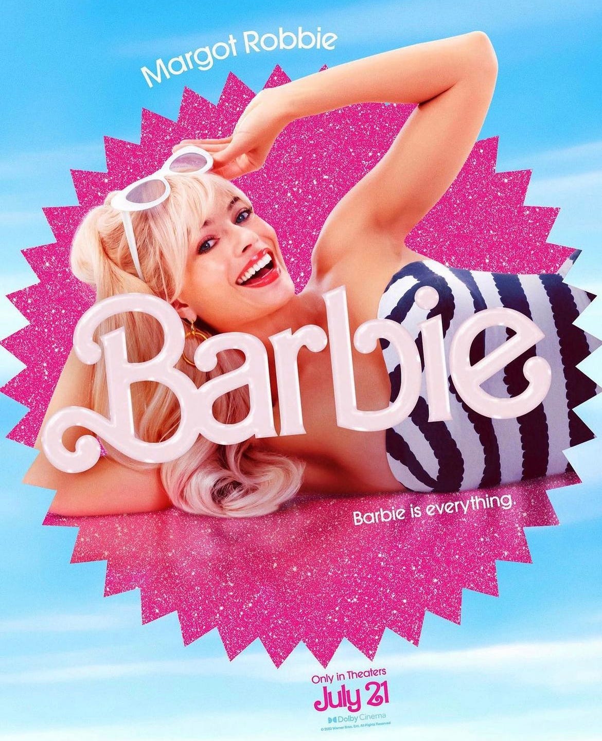 Margot Robbie poses for a Barbie Movie ad. She is lying on her side in a black and white striped swimsuit, and is smiling and raising her white sunglasses above her face. Text reads "Barbie is everything" and "Only in theaters on July 21"