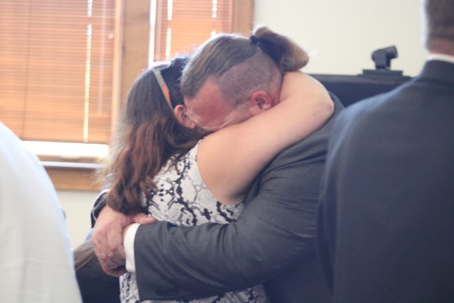 MIke Null and his wife embrace after the jury find him and his two co-defendants not guilty on all counts.