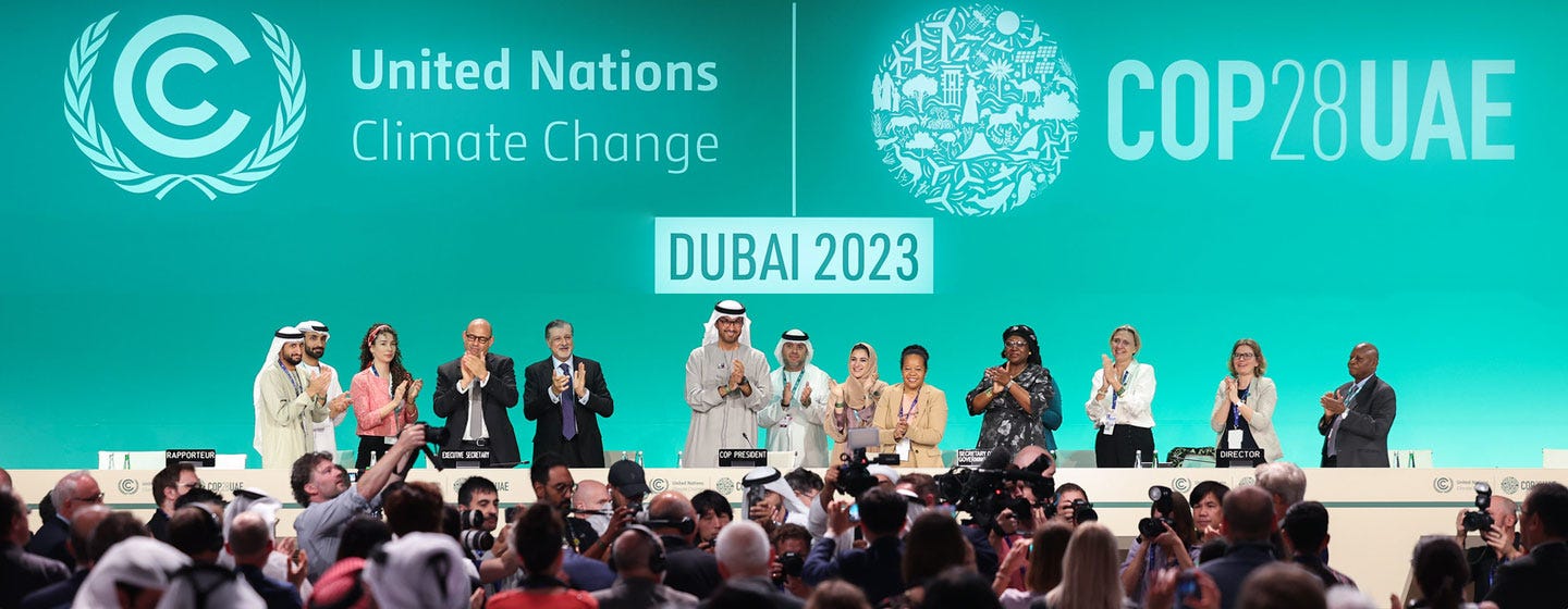 COP28 President Sultan Al Jaber (centre), UN climate chief Simon Stiell (fourth from left) and other participants onstage during the Closing Plenary of the UN Climate Change Conference, COP28, at Expo City in Dubai, United Arab Emirates.